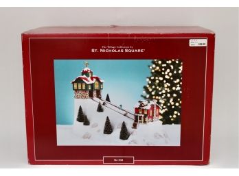 THE VILLAGE COLLECTION St. Nicholas Square Electric Ornamental Piece - Animated Christmas Skiers