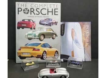 4 Porsche Cars With 2 Porsche Books.  The 2 Books Have Water Stains On Numerous Pages.