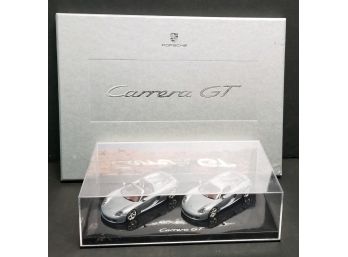 A 2003 Porsche Carrera GT Cased Book With 3 Separate Color Photos & Color Chart & 2 Carrera GT Models
