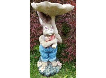 Cute Outdoor Ceramic Hare Holding A Mushroom Umbrella Or Is It A Bird Bath? Why Are His Eyes So Red?