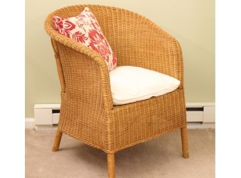 Wicker Arm Chair With Floral Accent Pillow