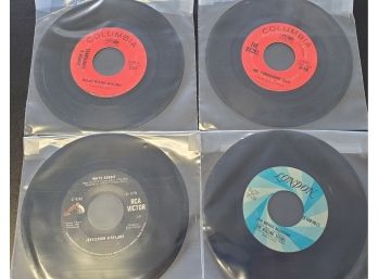 Four Vintage 45 Rpm Vintage Records- The Byrds, The Rolling Stones, Jefferson Airplane, Simon & Garfunkle