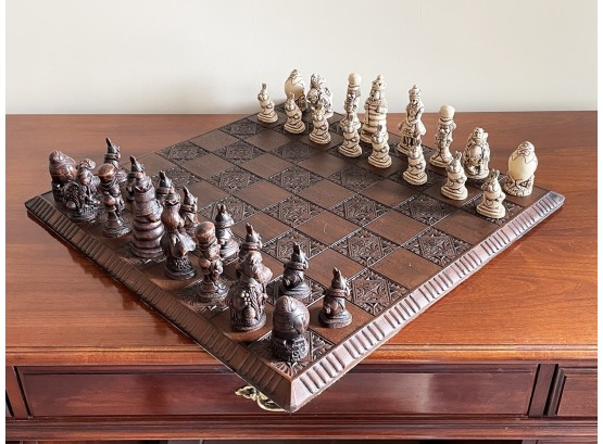 A Vintage Alice And Wonderland Themed Carved Wood Chess Set