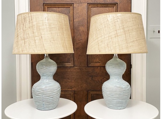 A Pair Of Modern Ceramic Lamps With Linen Shades
