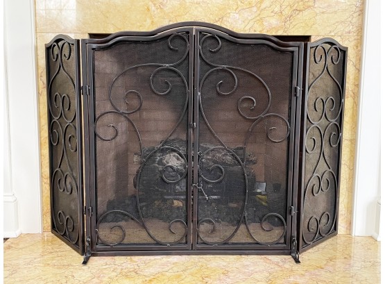 A Wrought Iron Fireplace Screen