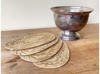 A Large Silverplate Champagne Bucket And Woven Placemats