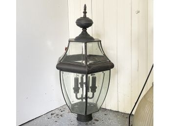A Copper And Glass Lampost Fixture