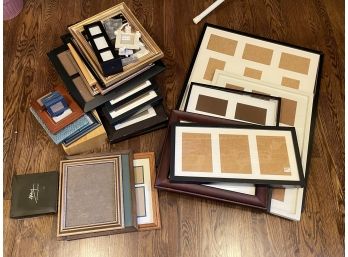 A Large Assortment Of Small Photo Frames