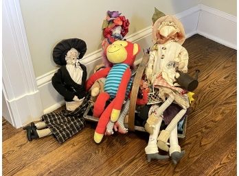 An Assortment Of Dolls And Stuffed Animals