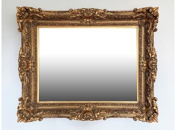 A Large Antique Gilt Framed Beveled Mirror