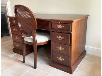 A Vintage Mahogany Desk And Caned Chair By Thomasville