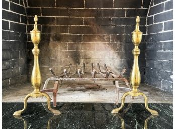A Pair Of Brass Andirons And Fireplace Grate