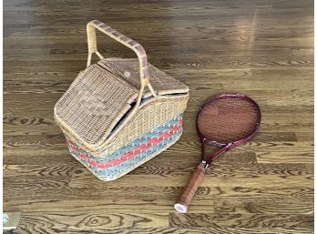 A Vintage Picnic Basket And Tennis Racket