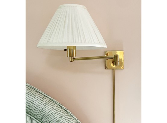 A Pair Of Brass Articulating Arm Sconces