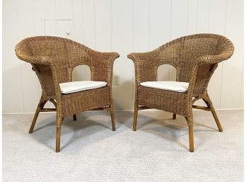 A Pair Of Vintage Wicker Chairs With Linen Cushions