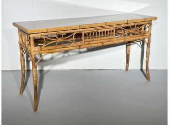 A Vintage Rattan Console With Smoked Glass Top