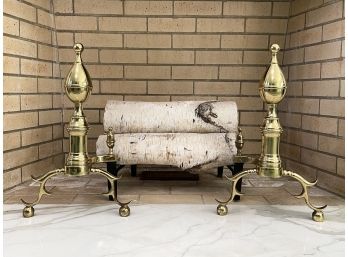A Pair Of Polished Brass Andirons And Birchwood Logs