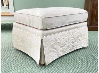 An Upholstered Ottoman By Kay Lyn Furniture