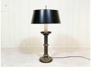 A Vintage Brass Stick Lamp With Black Shade