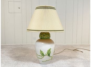 A Glazed Ceramic Lamp With Leaf Motif And Custom Shade