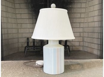An Iridescent Glazed Lamp With Linen Shade
