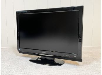 A Sharp Aquos 30' Flat Screen TV