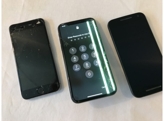 Three  Busted-up Old Smartphones
