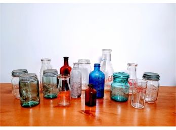 Group Of Multi- Colored Jars And Glasses