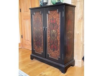A Painted Wood Cabinet With Inset Panels