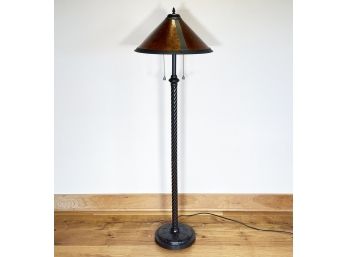 A Torchiere Lamp In Bronze Tone