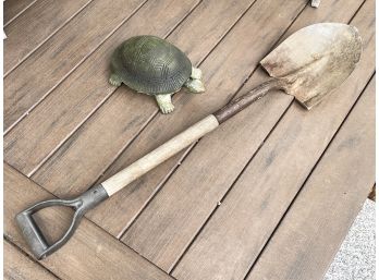 A Garden Turtle And Shovel