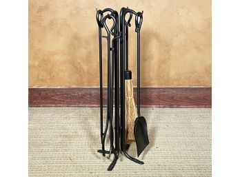 A Set Of Wrought Iron Fireplace Tools