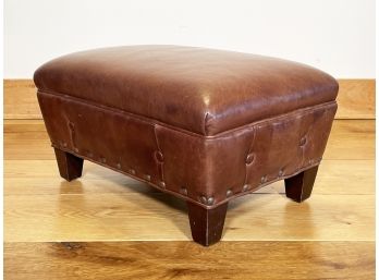 A Leather Footstool With Nailhead Trim