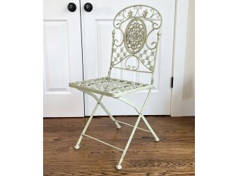 A Wrought Iron Folding Chair