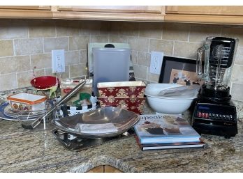 A Blender And Large Assortment Of Kitchen Ware