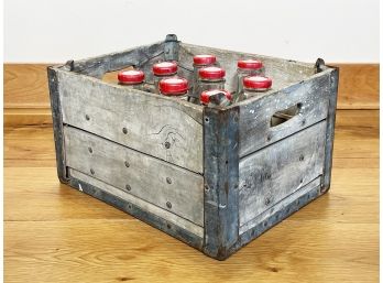 A Vintage Crate And Bottles