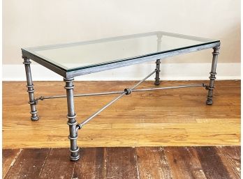 A Glass Top Coffee Table On Wrought Iron Base By Pier 1 Imports