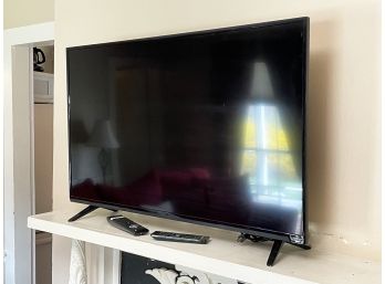 A Sony Vizio 40' Flat Screen Smart TV And Stand