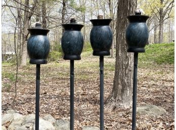 A Set Of 4 Outdoor Torches