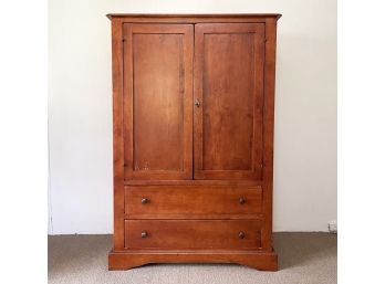 A Wood Entertainment Or Wardrobe Cabinet With Smart TV