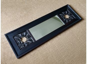 An Accent Mirror With Wrought Iron Details