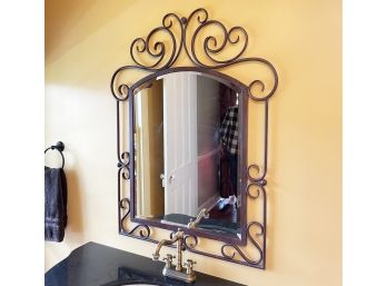 A Wrought Iron Framed Mirror