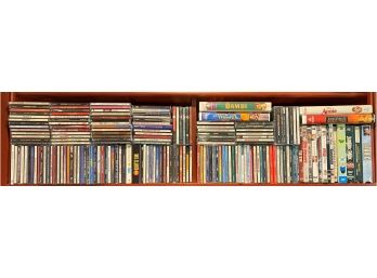 Large Collection Of CD's, DVD's And VCR.