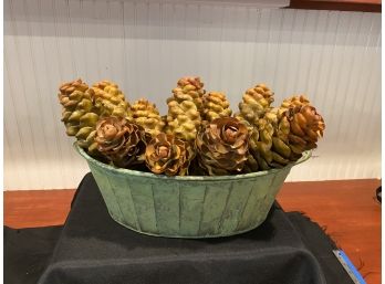 A Decorative Distressed Zink Or Metal  Centerpiece With Faux Pine Cone