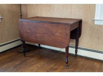 Vintage Drop Leaf Table With Reeded Legs On Casters