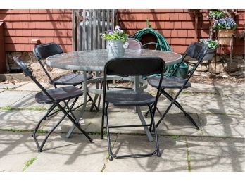 Outdoor Glass Topped Table W Five Folding Chairs