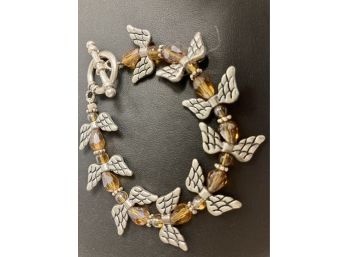 Bracelet With Yellow Stones And Wings Toggle Type Like Angles