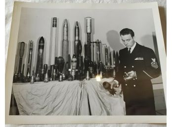 World War II U.S. Navy Photo: Navy Ordinance Expert Displays Enemy Mortar Shells & Bombs