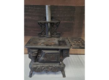 Antique Crescent Cast Iron Toy Stove With Griddle & 4 Pot Grates Stove Pipe & Side Flap. Front Door Opens.