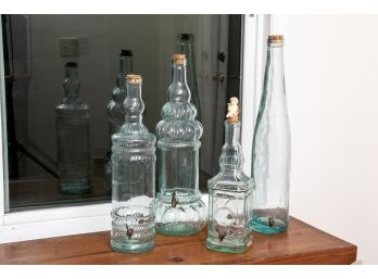 Four Decorative Glass Bottles With Spigots